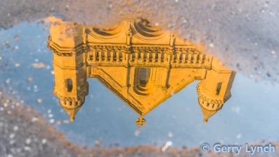St Anne's Cathedral, Belfast, reflected in a puddle on Donegall Street, 29 April 2020, © Gerry Lynch